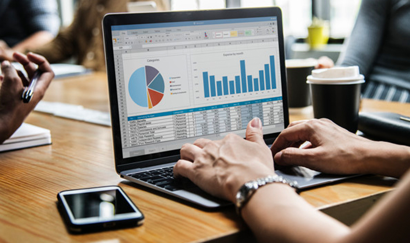 Cyber professionals reviewing data and security strategies on screen.